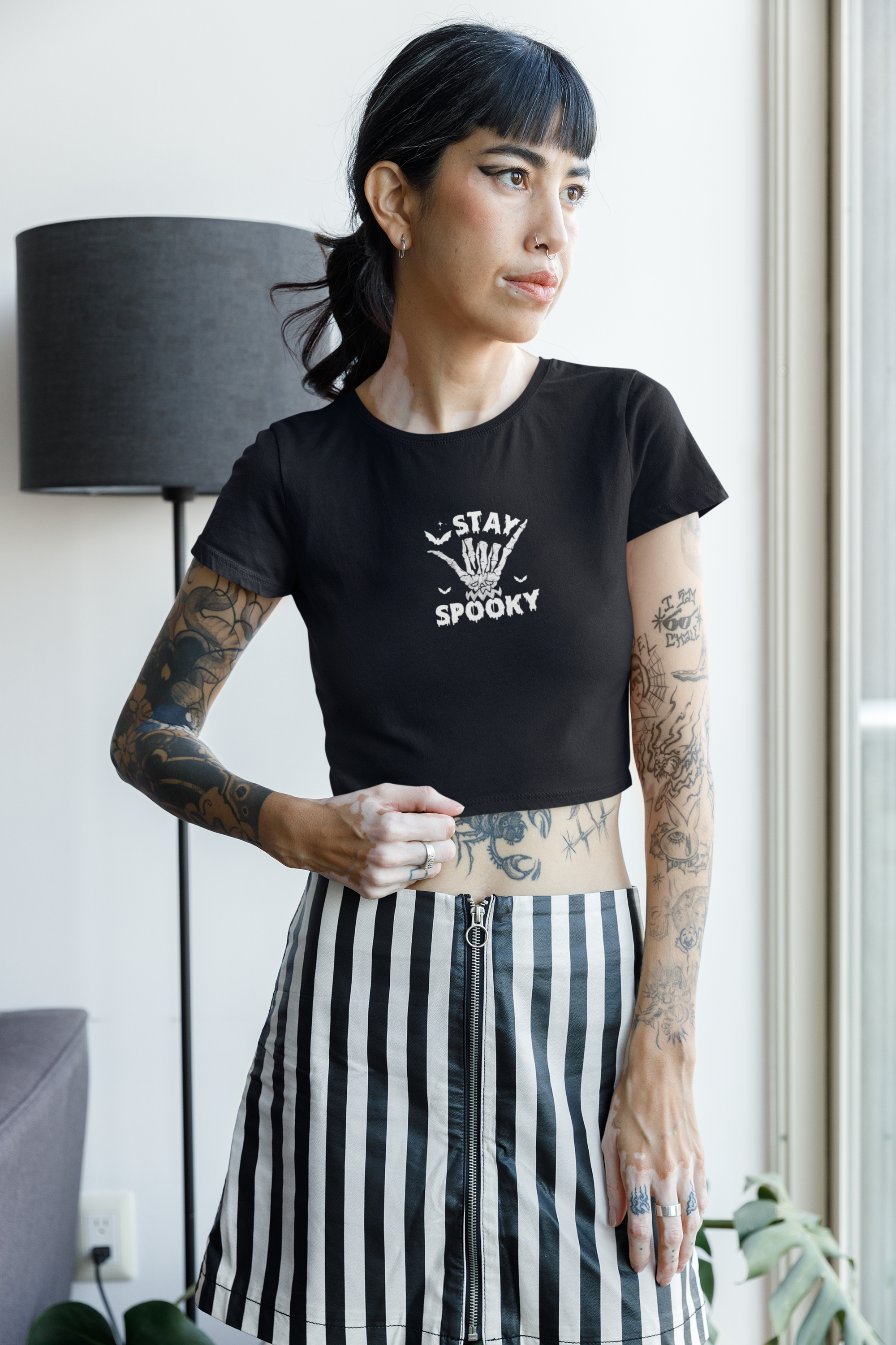 Black crop top with 'Stay Spooky' graphic featuring a skeletal hand and bats, perfect for Halloween lovers and gothic fashion 