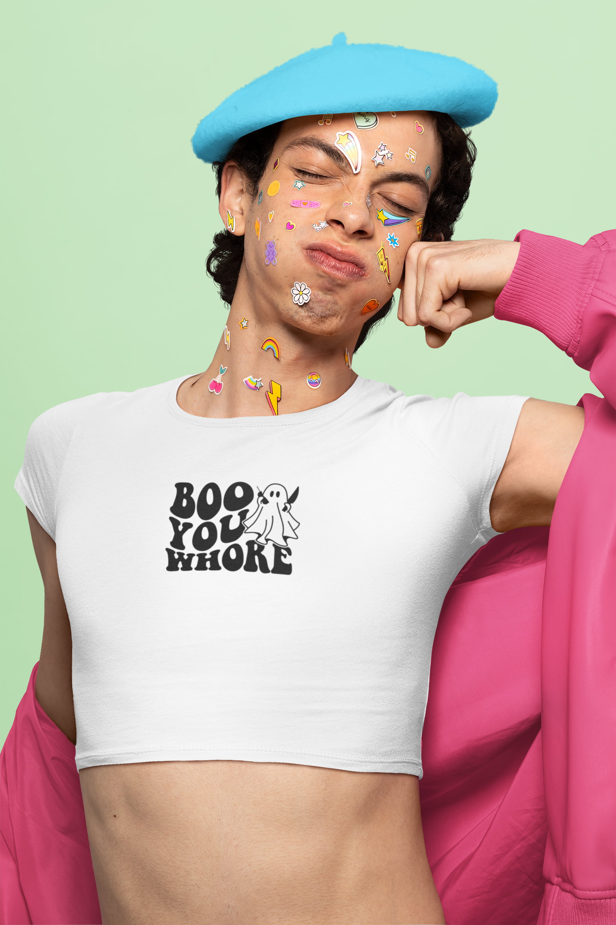 White crop top featuring a playful ghost next to the bold text 'Boo You Whore' in a retro font, combining Halloween fun with a cheeky twist