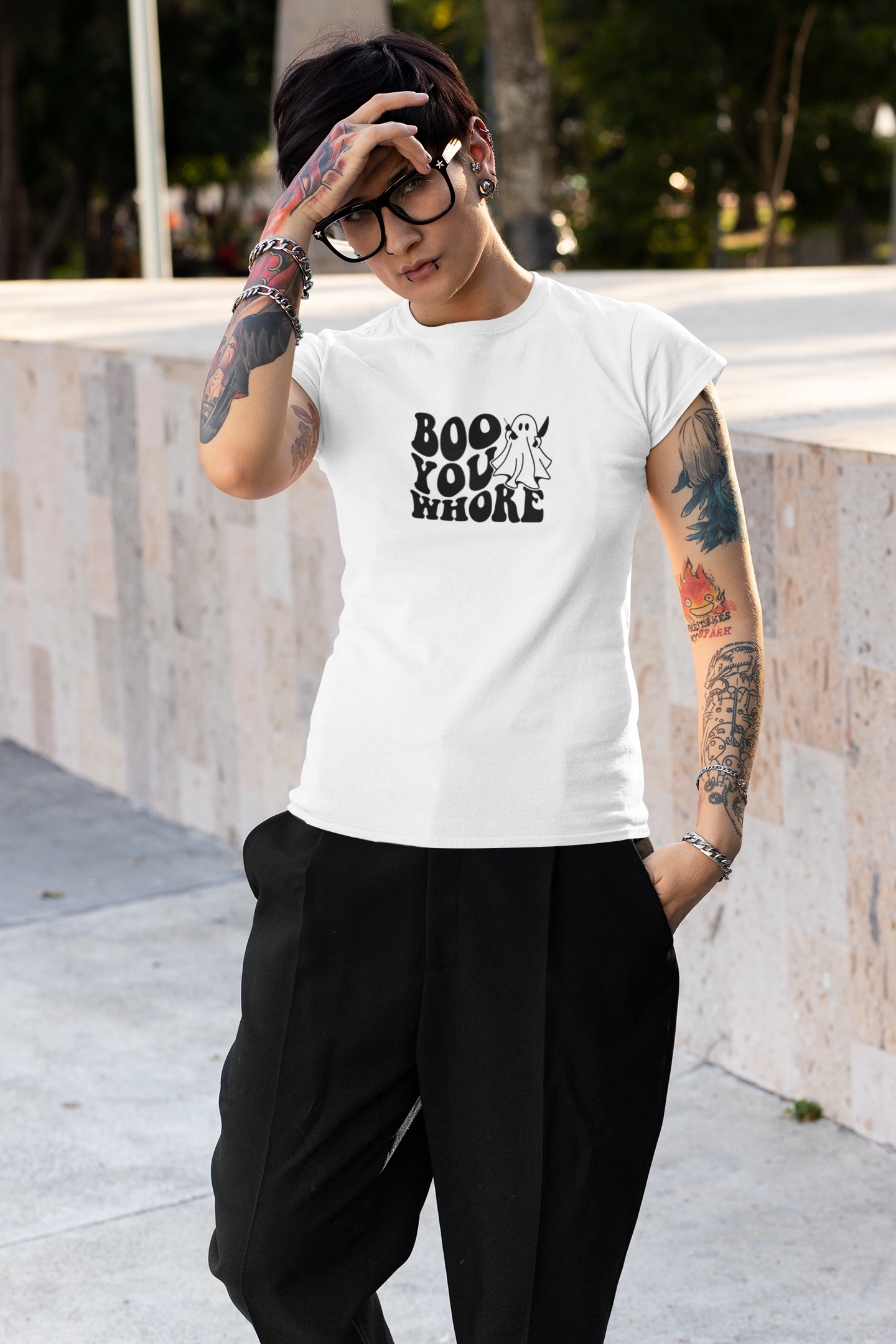 White t-shirt featuring a playful ghost and the bold text 'Boo You Whore' in a retro font, perfect for adding some Halloween humor.